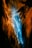 A vibrant abstract image featuring a dynamic interplay of colors. Bright blue tones flow through the center, surrounded by rich shades of orange and black creating an effect reminiscent of a flowing river or waterfall in vibrant motion.