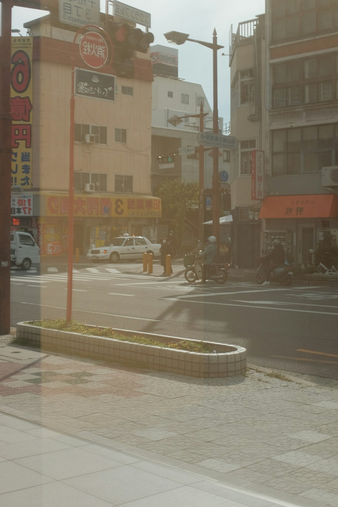 cars on road near buildings during daytime