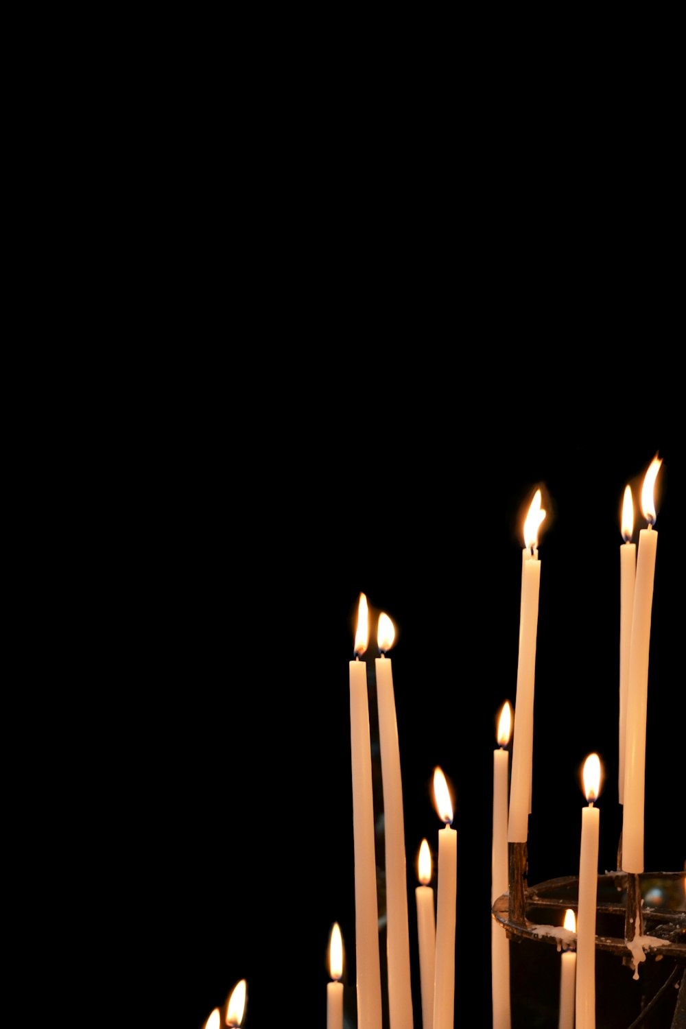 lighted candles in the dark