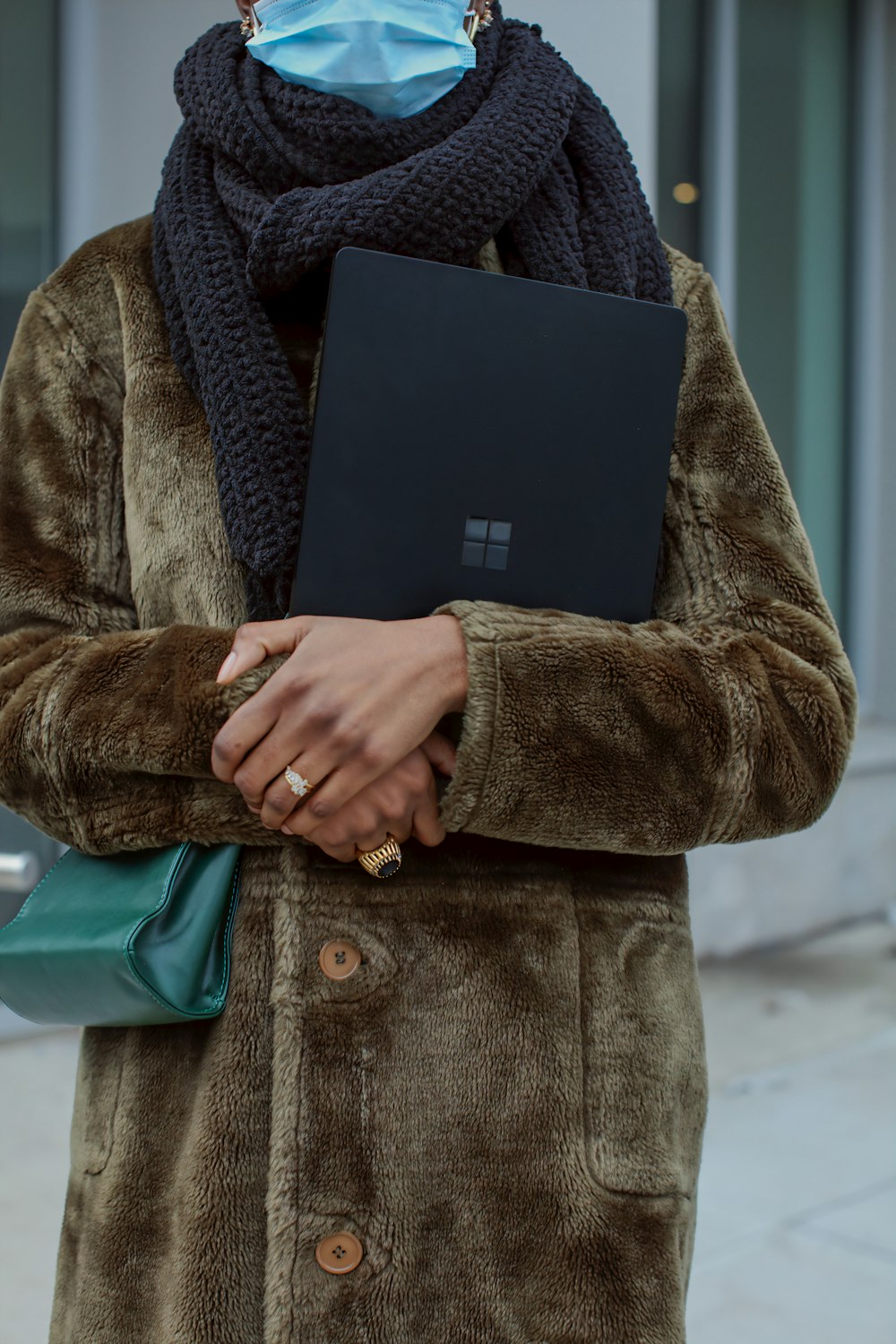 person holding black Surface device