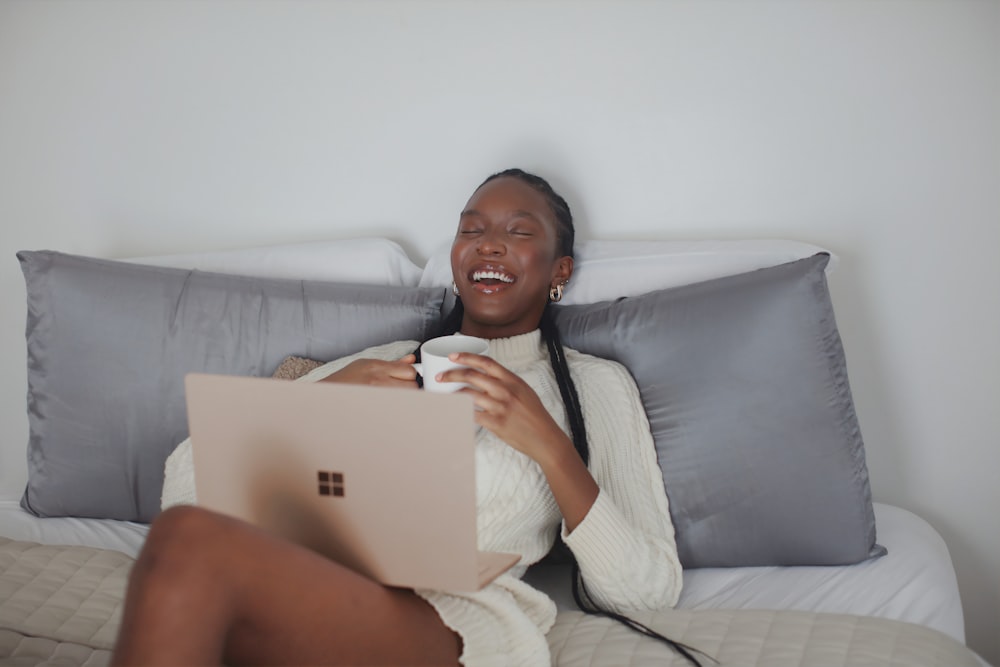 person in white long sleeve shirt holding Surface device