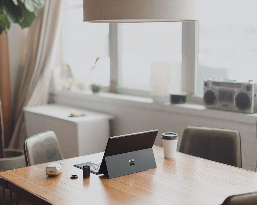 black Surface device on brown wooden table