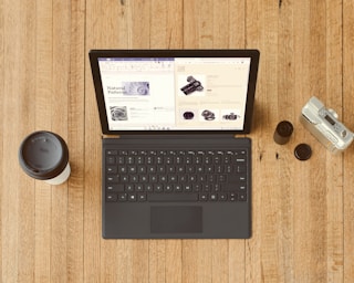 black Surface device on brown wooden table