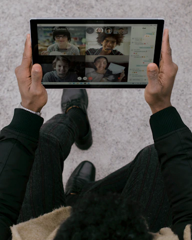 Group chat interface on a tablet displaying colorful user avatars and messages.