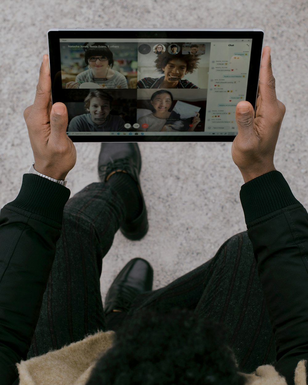 person holding black tablet Surface