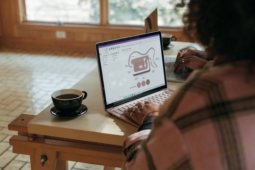 person using Surface device on table