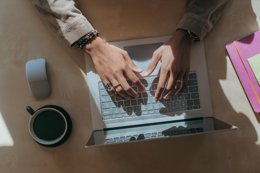 person typing on Surface laptop