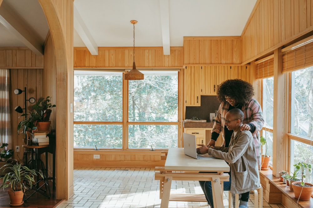 person sitting on chair in front of table