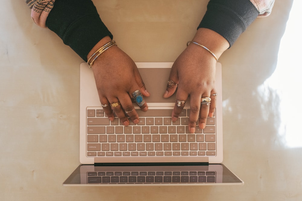 person wearing silver ring using a Surface device