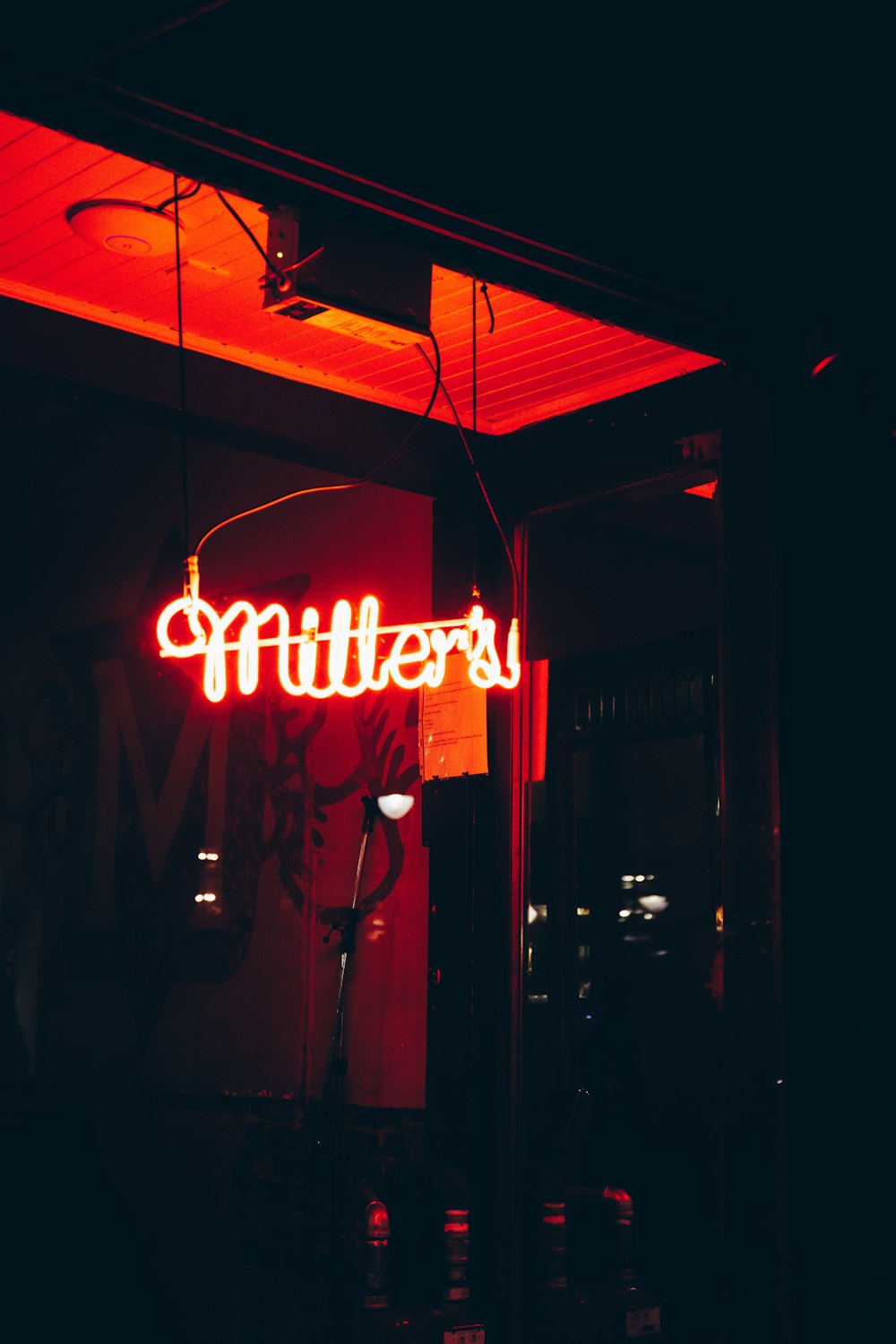 red and white UNKs coffee neon signage