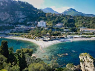 aerial view of city near body of water during daytime