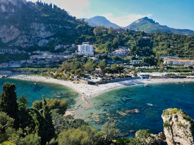 aerial view of city near body of water during daytime