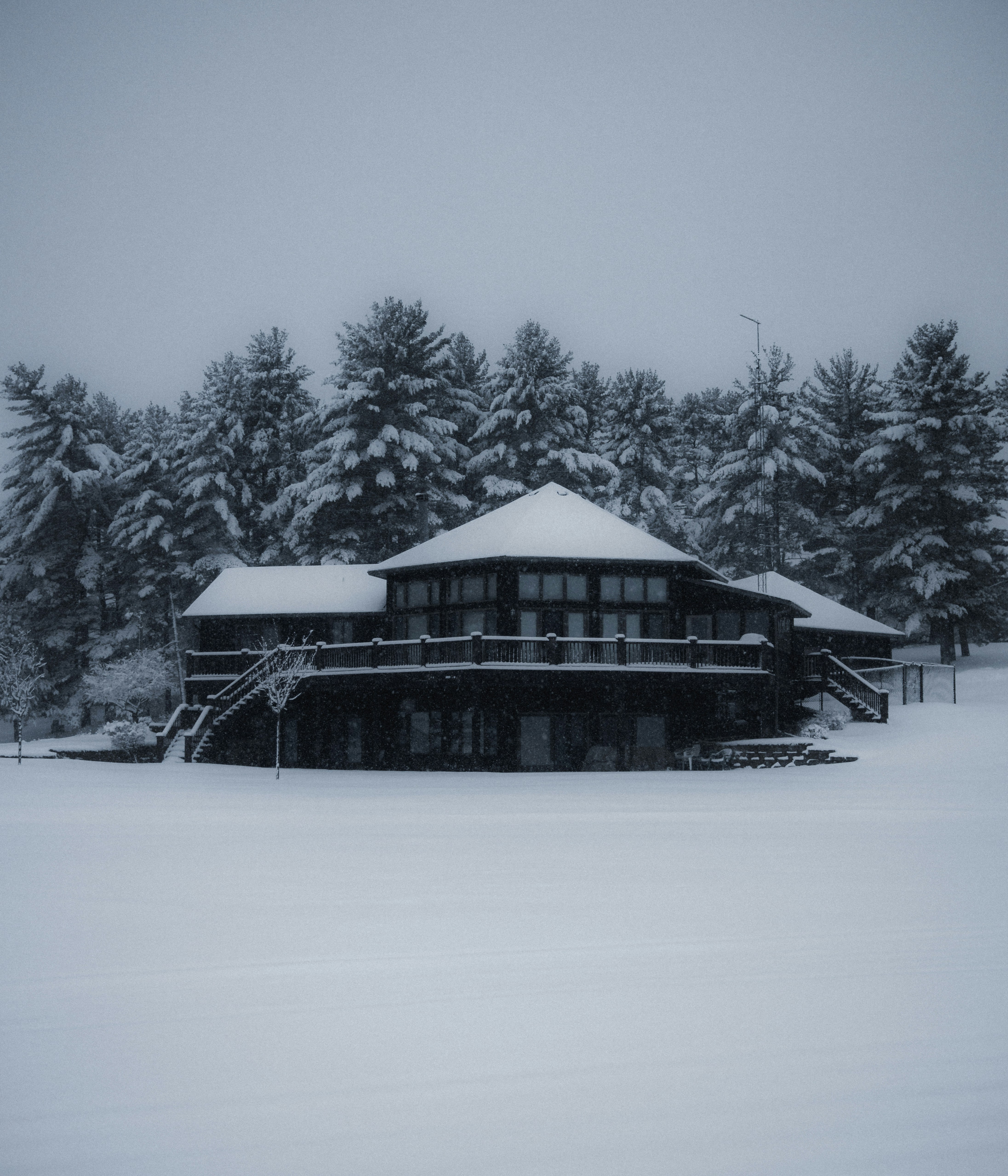 brown wooden house covered with snow