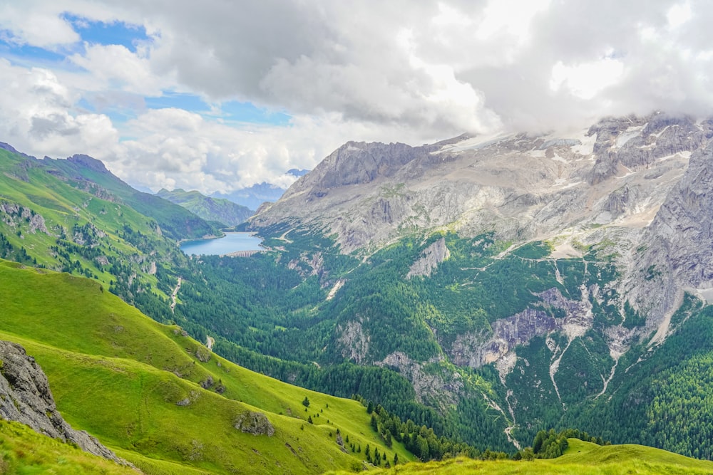 green mountains under white clouds during daytime