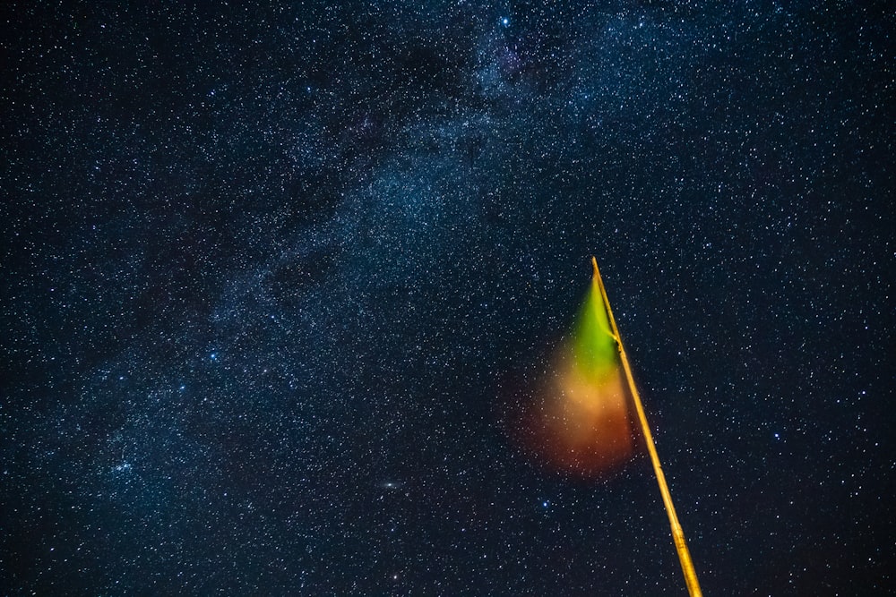 yellow and black tent under starry night