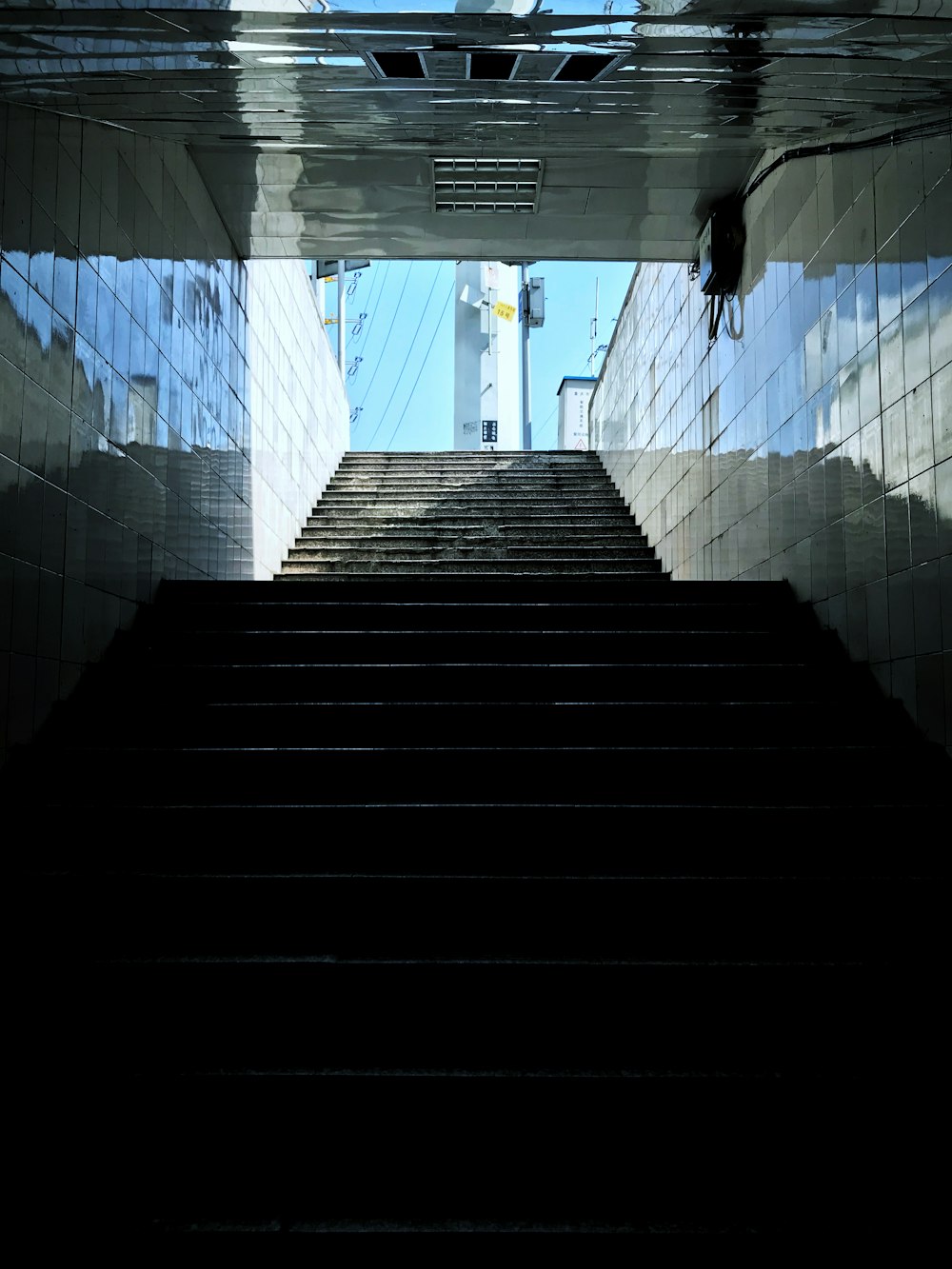 blue and white tiled hallway