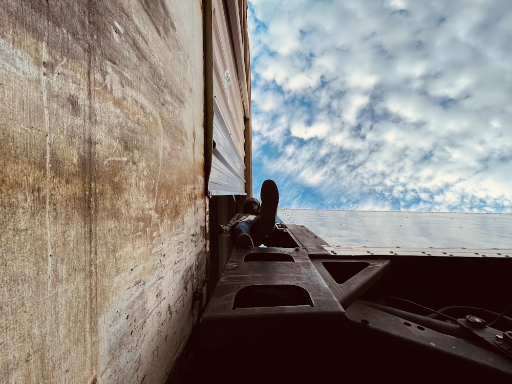 man in black shirt sitting on boat during daytime