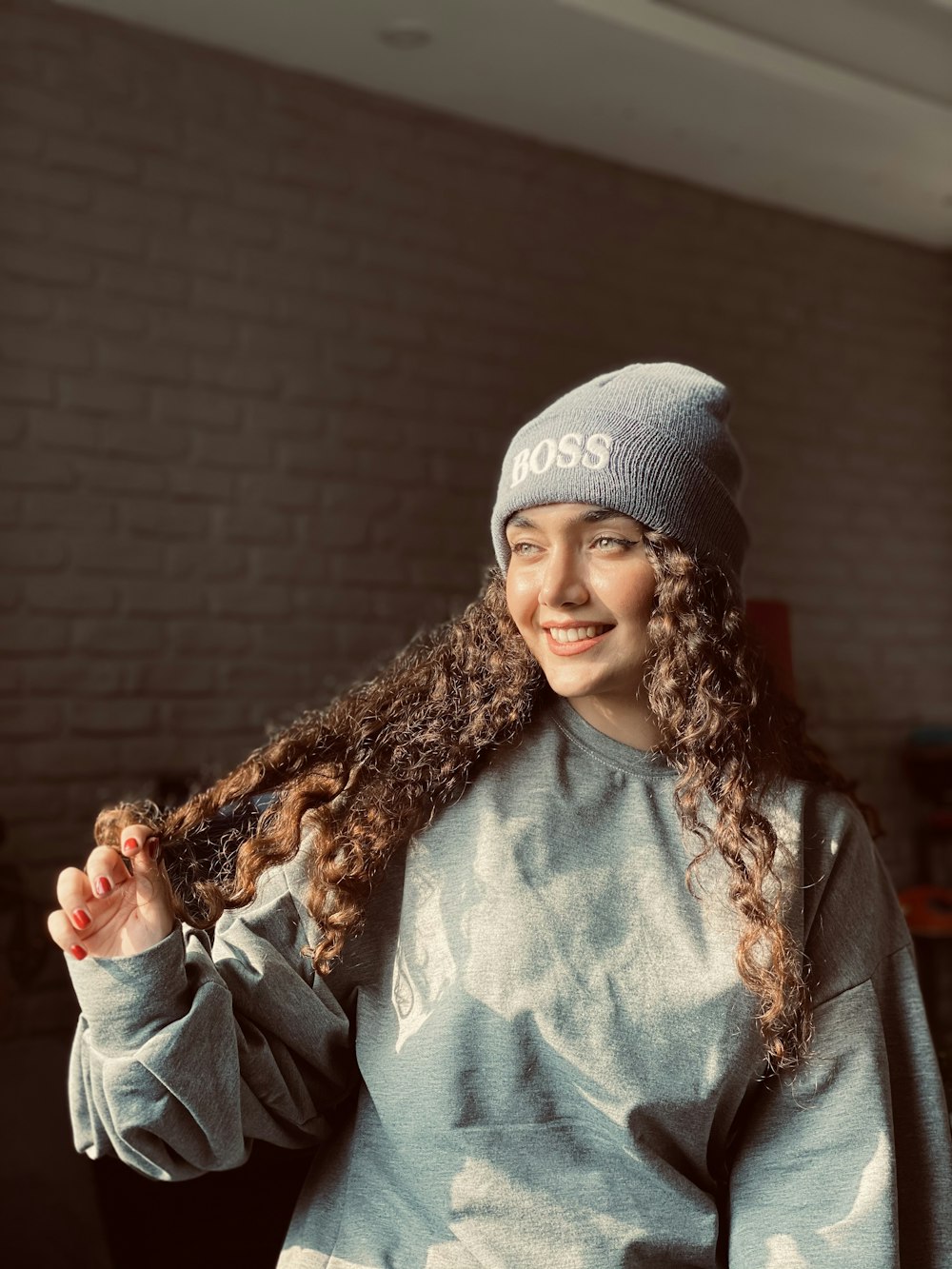 woman in gray knit cap and black coat