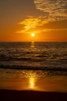 body of water during sunset