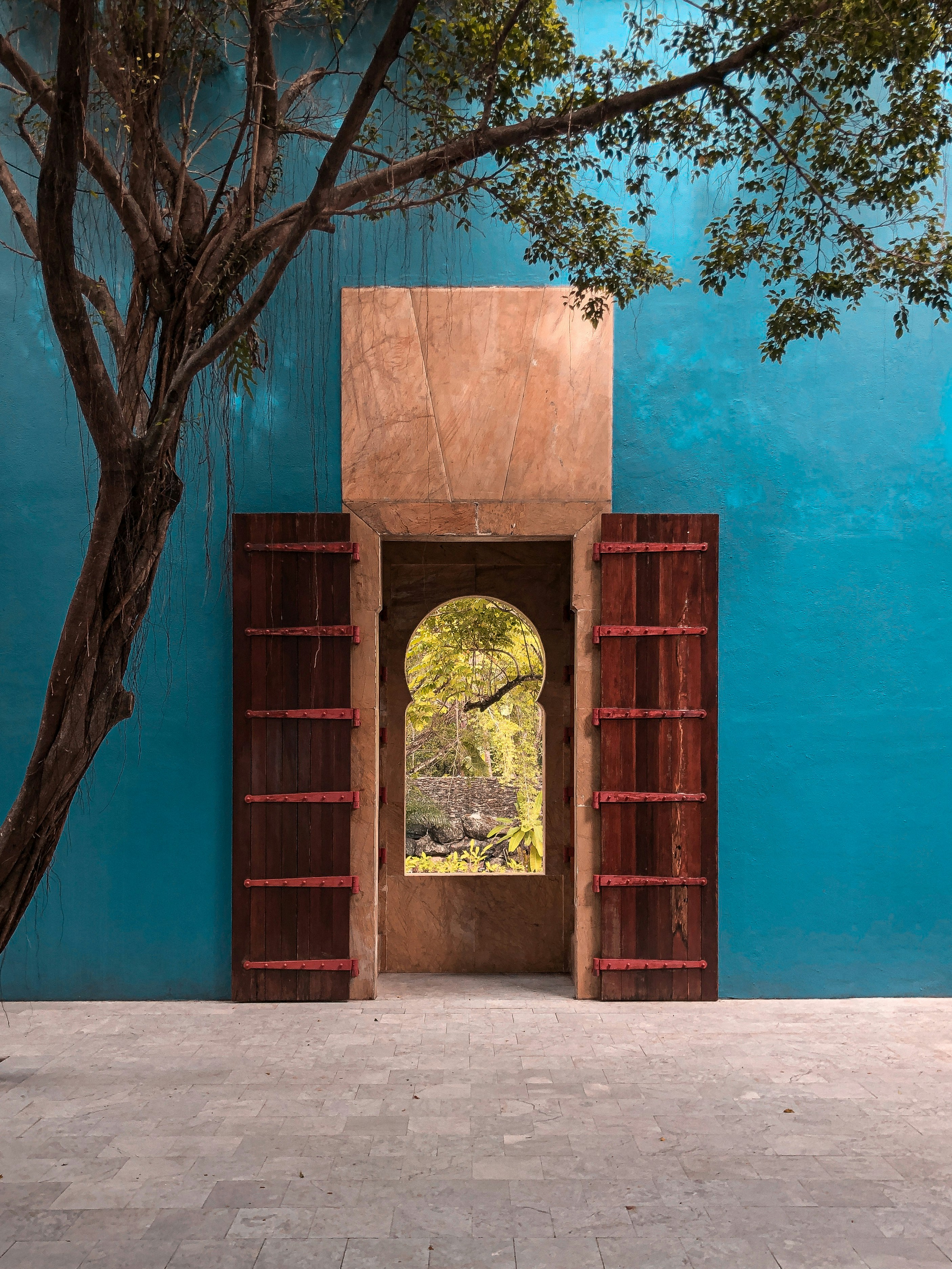 brown wooden door with black metal door lever