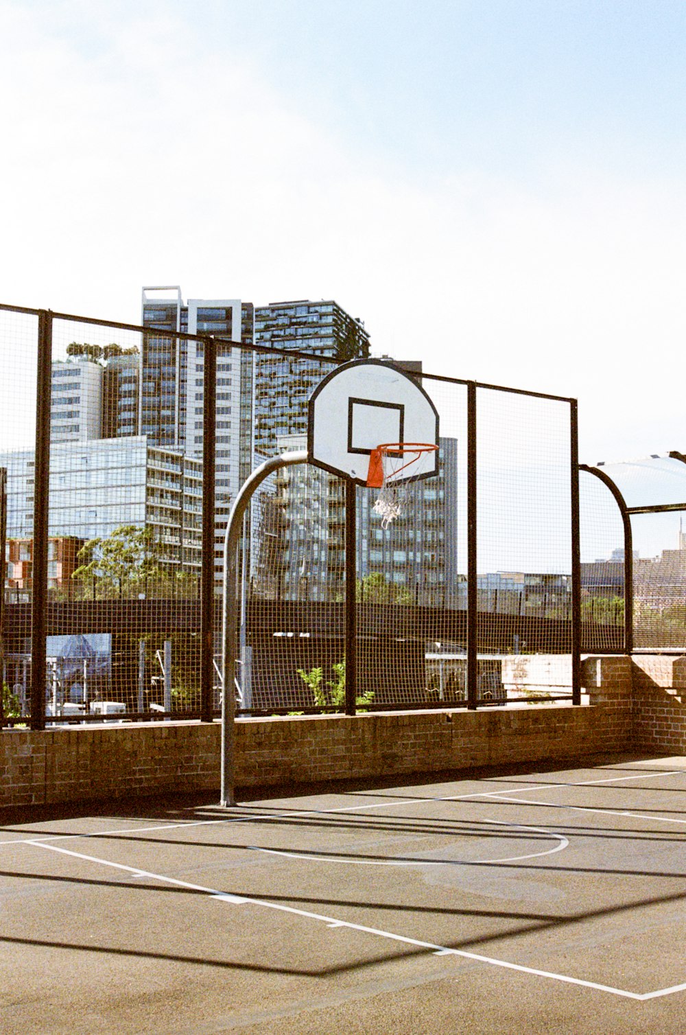 basketball hoop near building during daytime