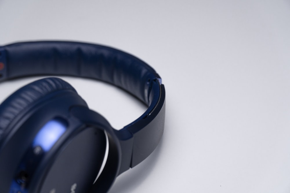 black and blue corded headphones
