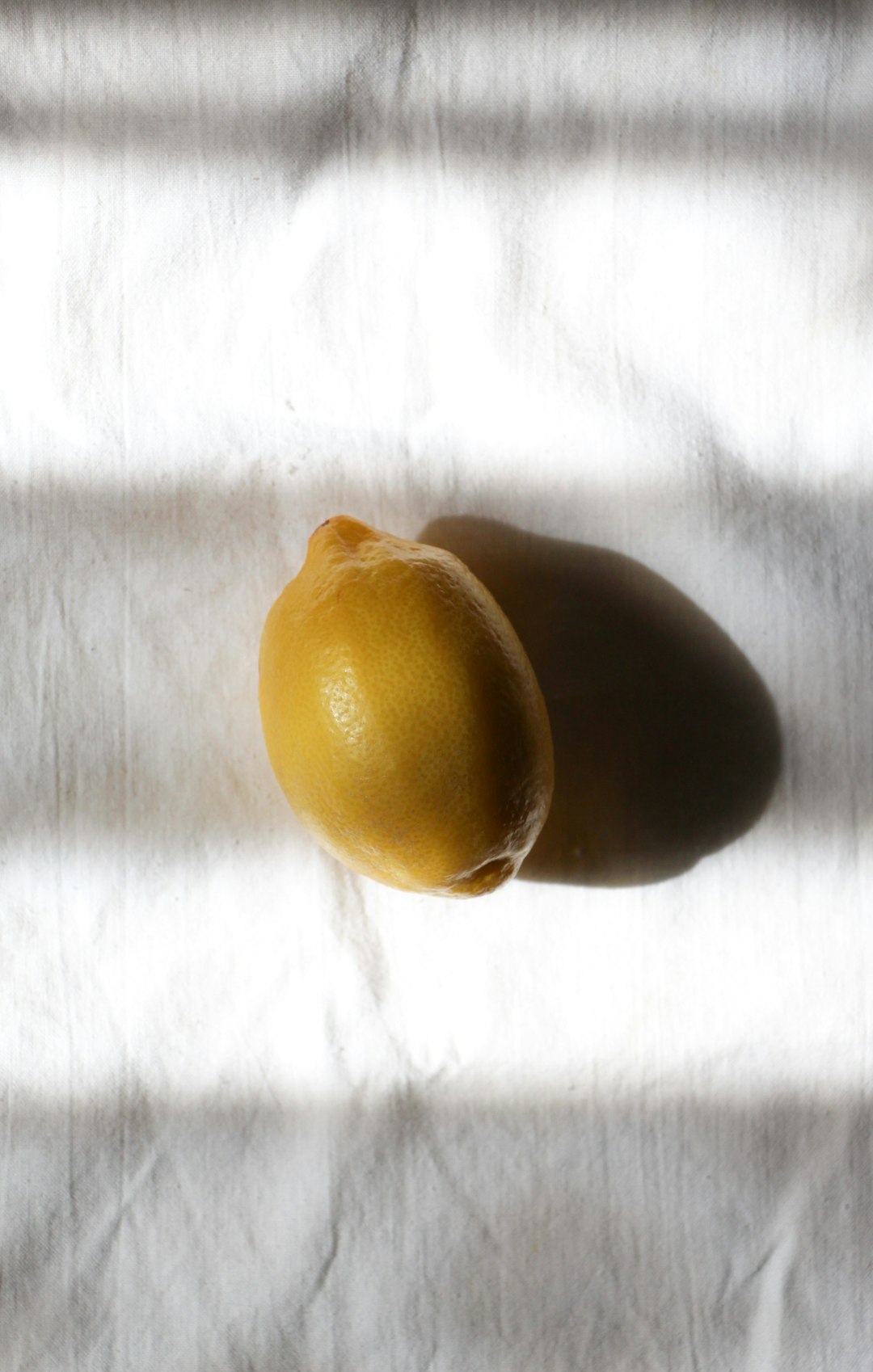 yellow fruit on white textile