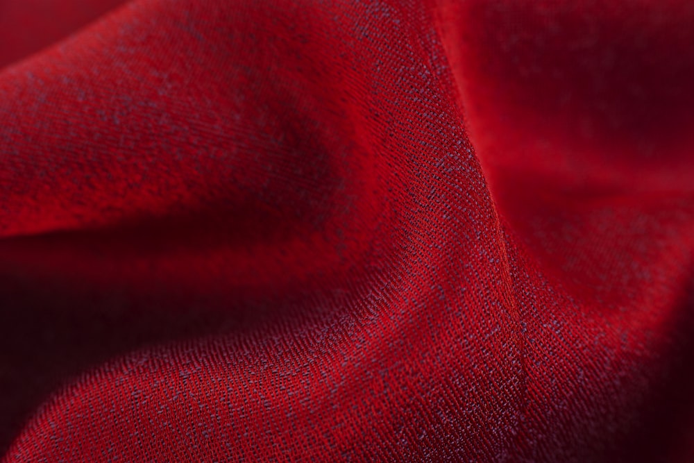 red textile in close up photography