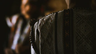A serene photo of a traditional heritage textile pattern illuminated by soft natural light
