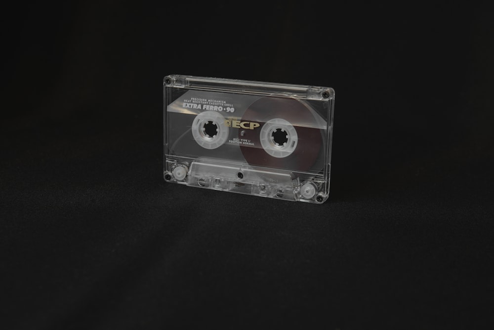 black cassette tape on black textile