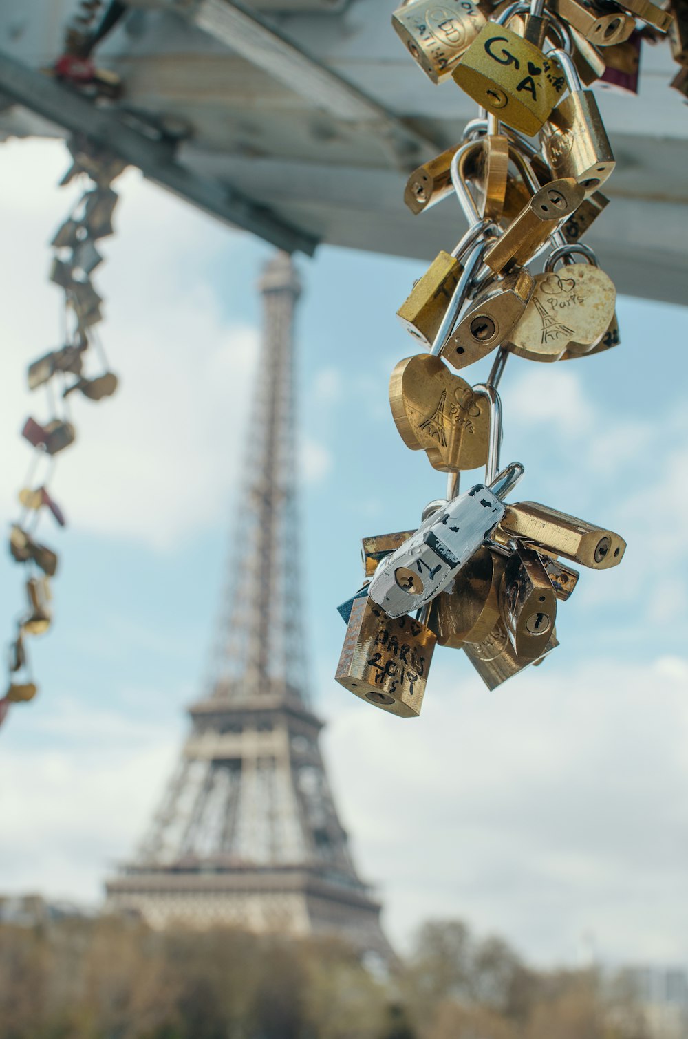 gold padlock on brown metal chain during daytime