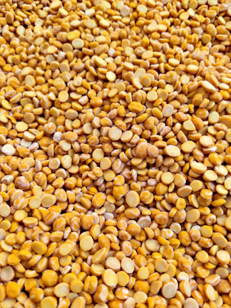 yellow and brown beans on brown wooden table
