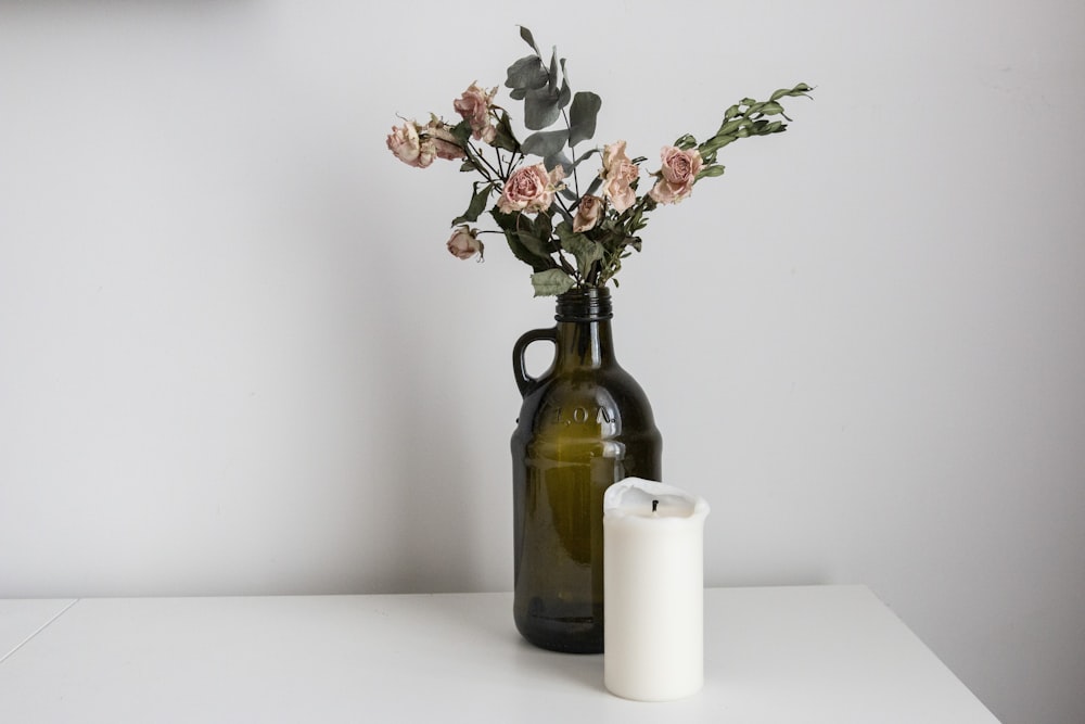 white flowers in brown glass vase