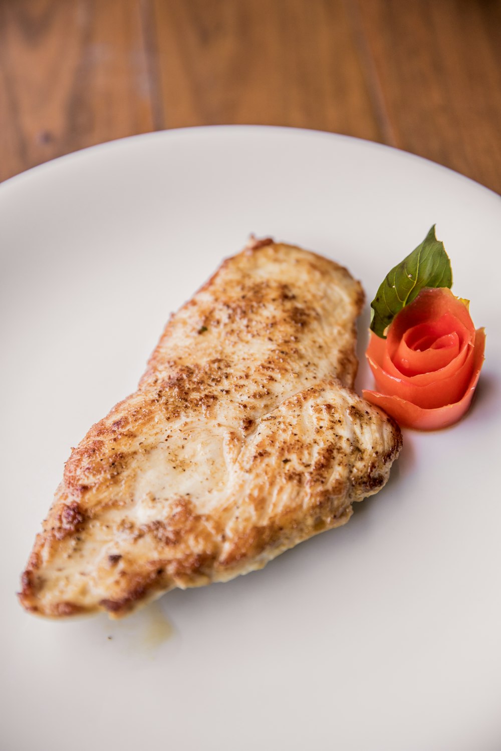 bread with tomato on white ceramic plate