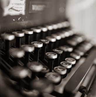 black and white typewriter on table