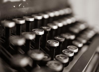 black and white typewriter on table