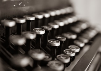black and white typewriter on table