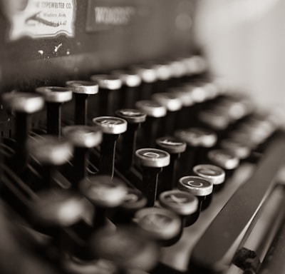 black and white typewriter on table
