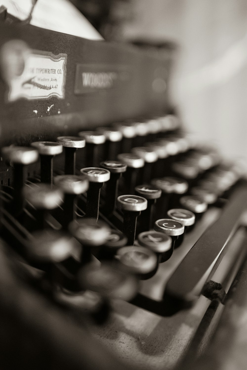 black and white typewriter on table