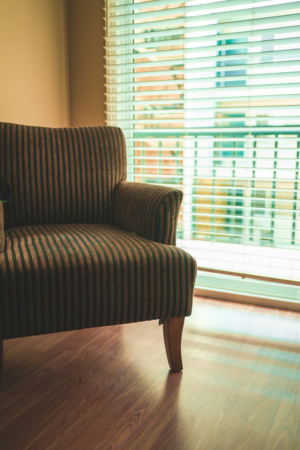 brown and black striped sofa chair