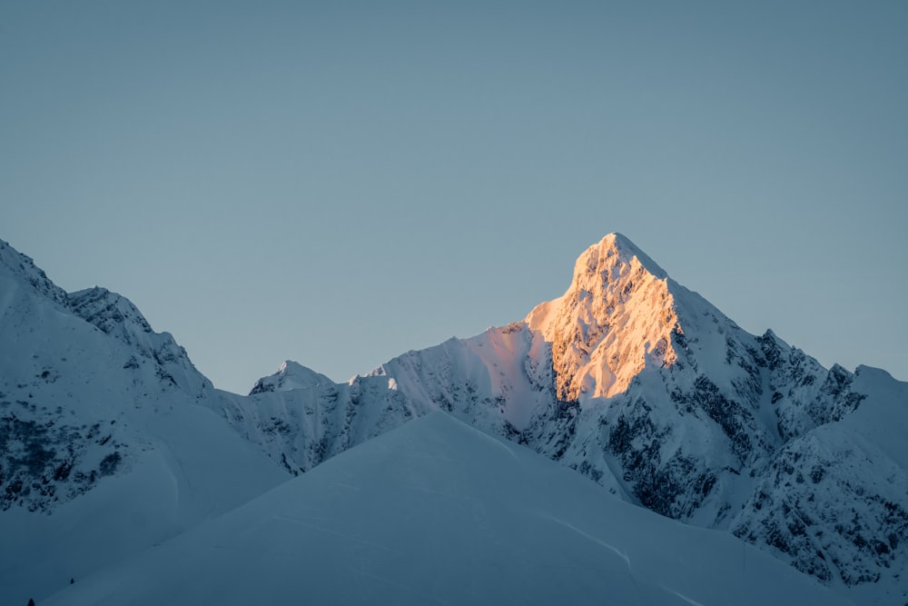 snow covered mountain under blue sky during daytime