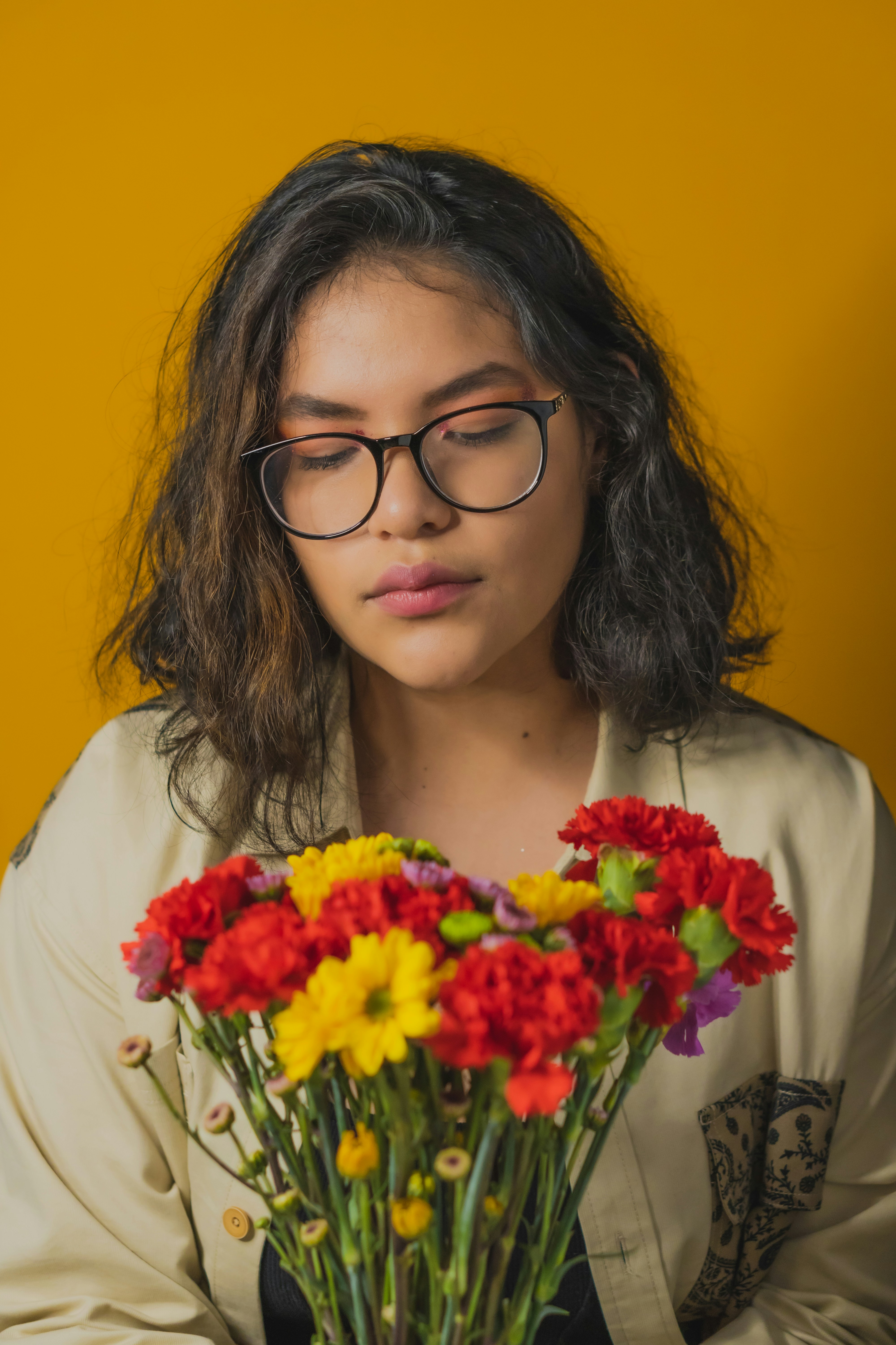 Woman in white shirt holding bouquet