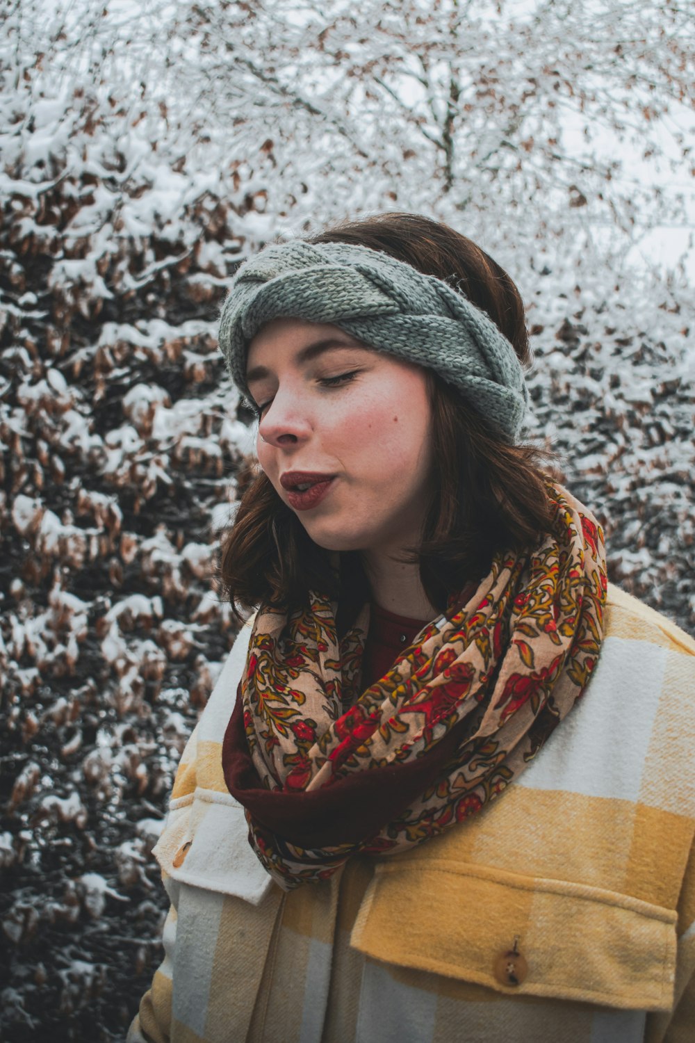 woman in white and brown scarf
