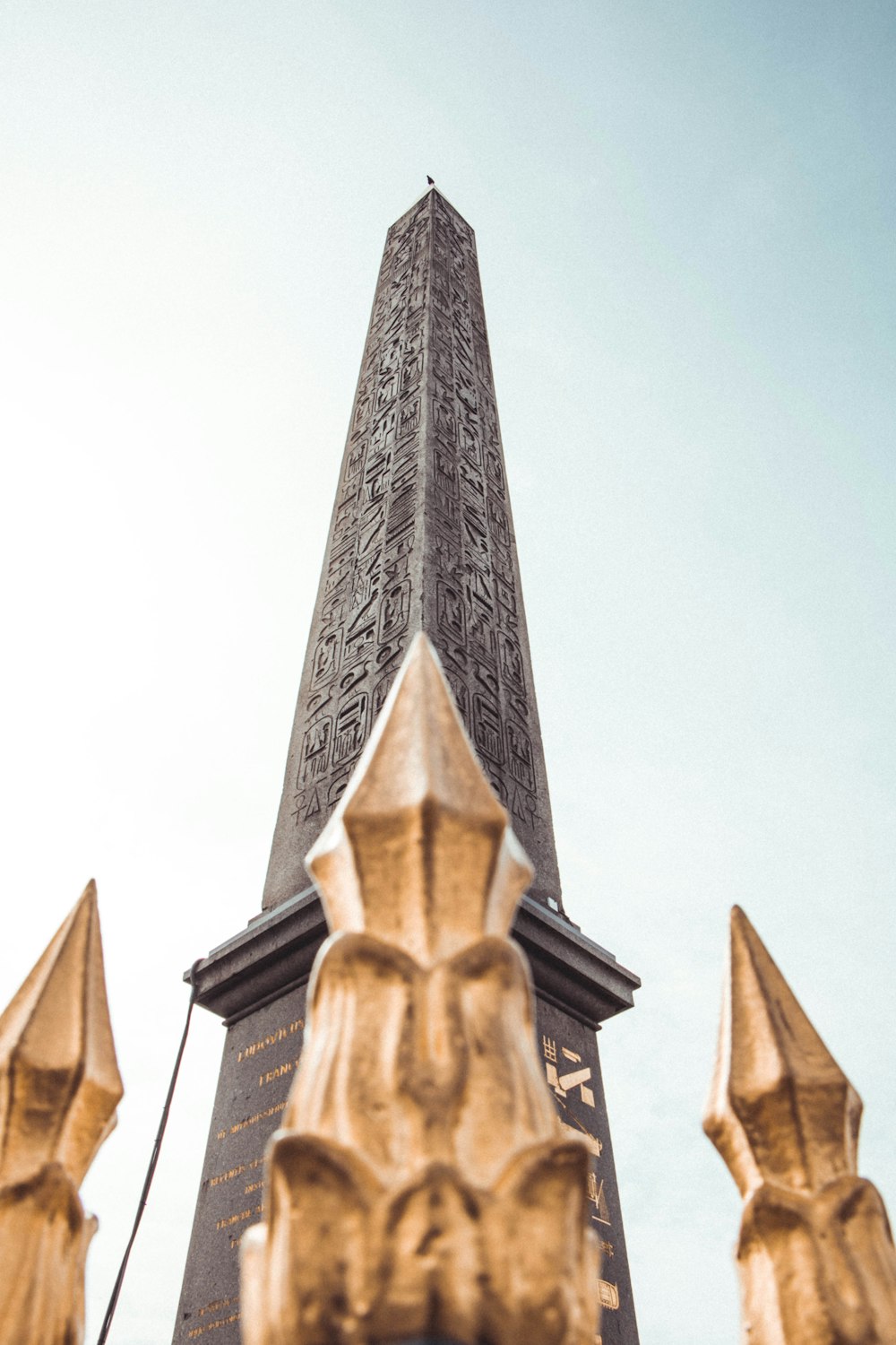 gold angel statue under white sky during daytime