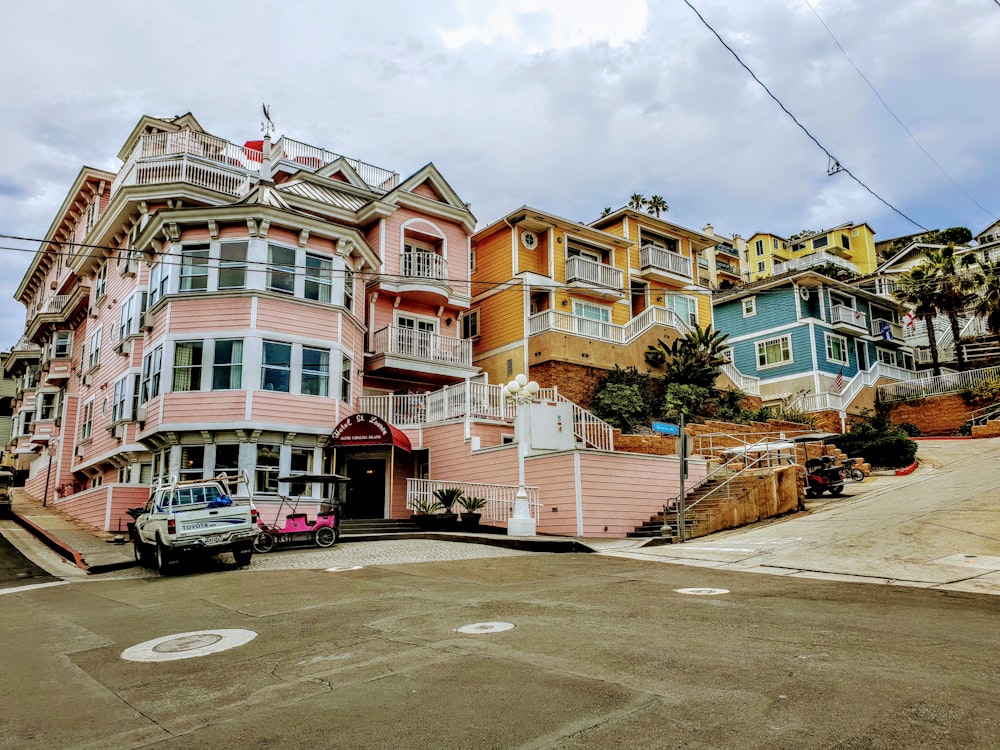 cars parked in front of building during daytime