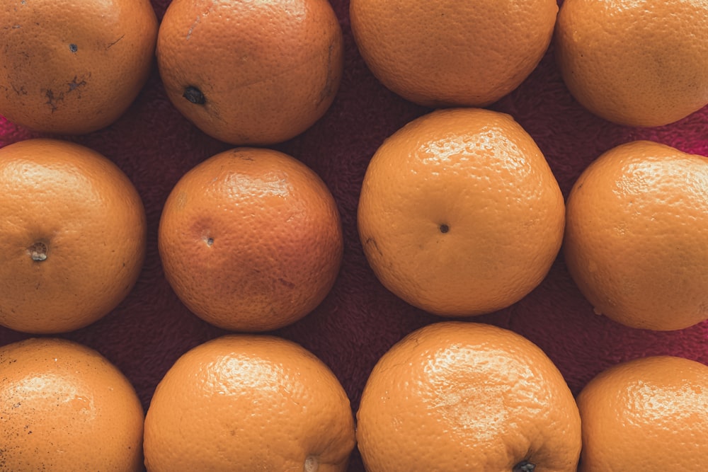 orange fruits on brown surface
