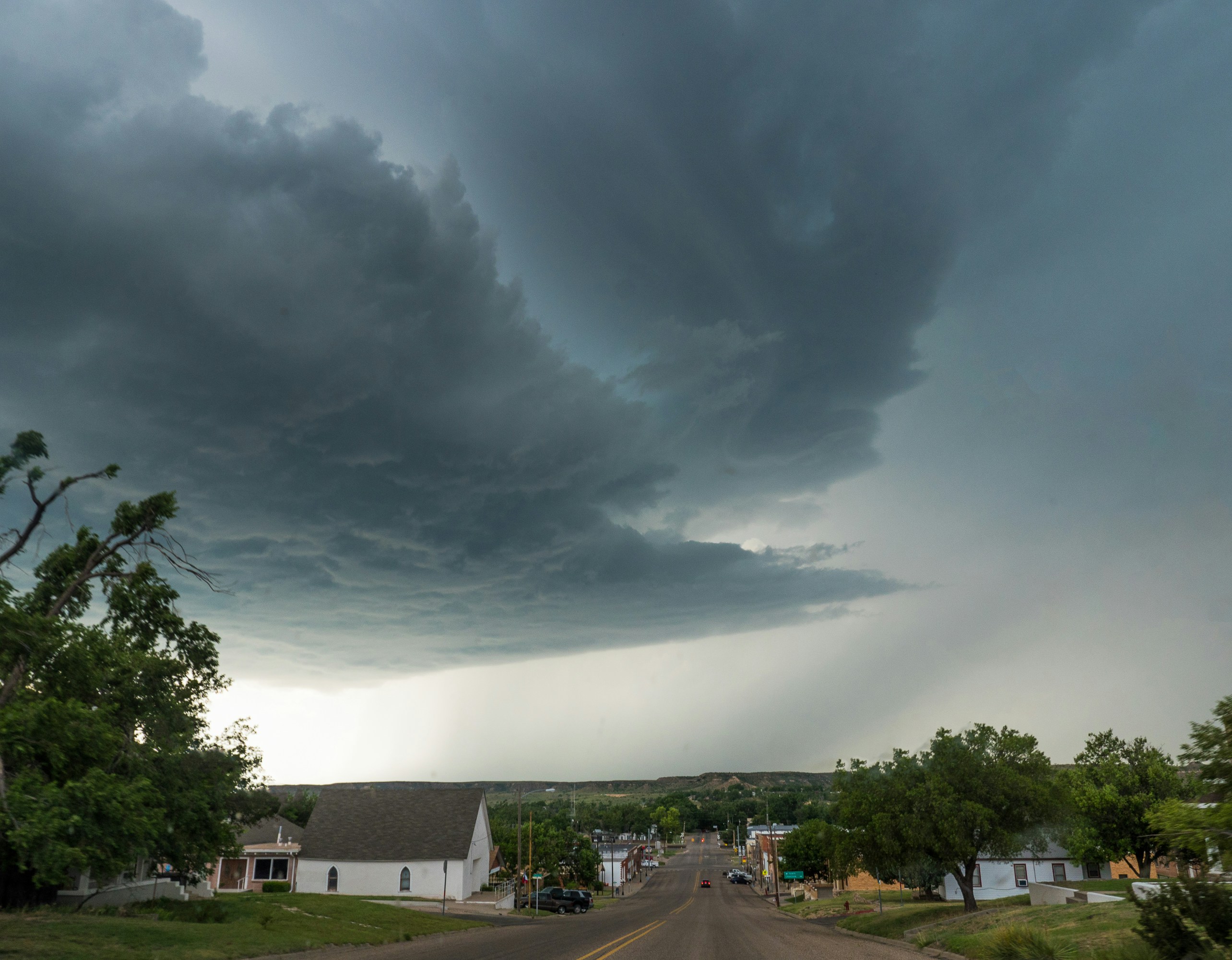 A dark storm cloud over a Central Texas neighborhood - Window repair Georgetown TX