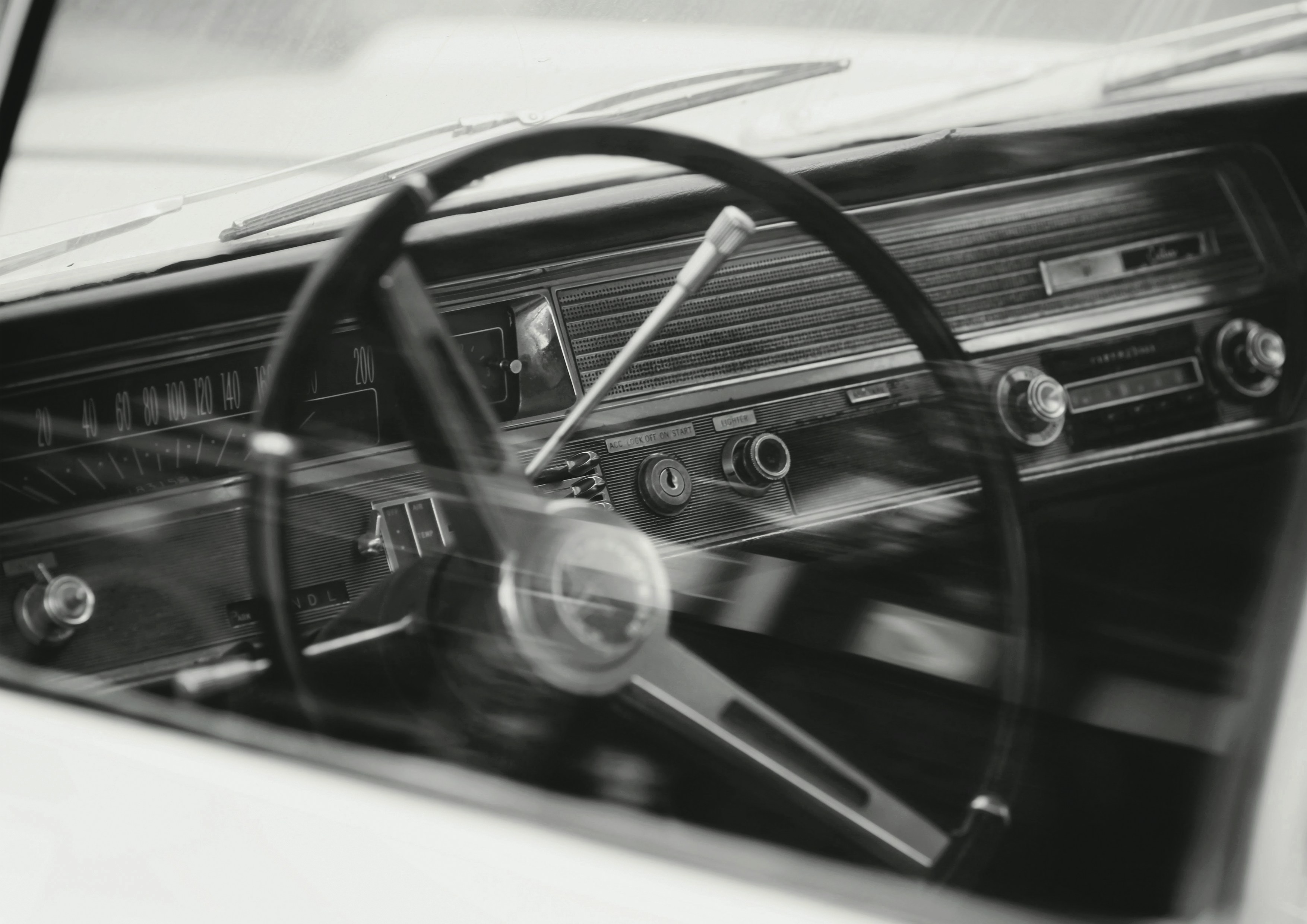 black steering wheel in close up photography