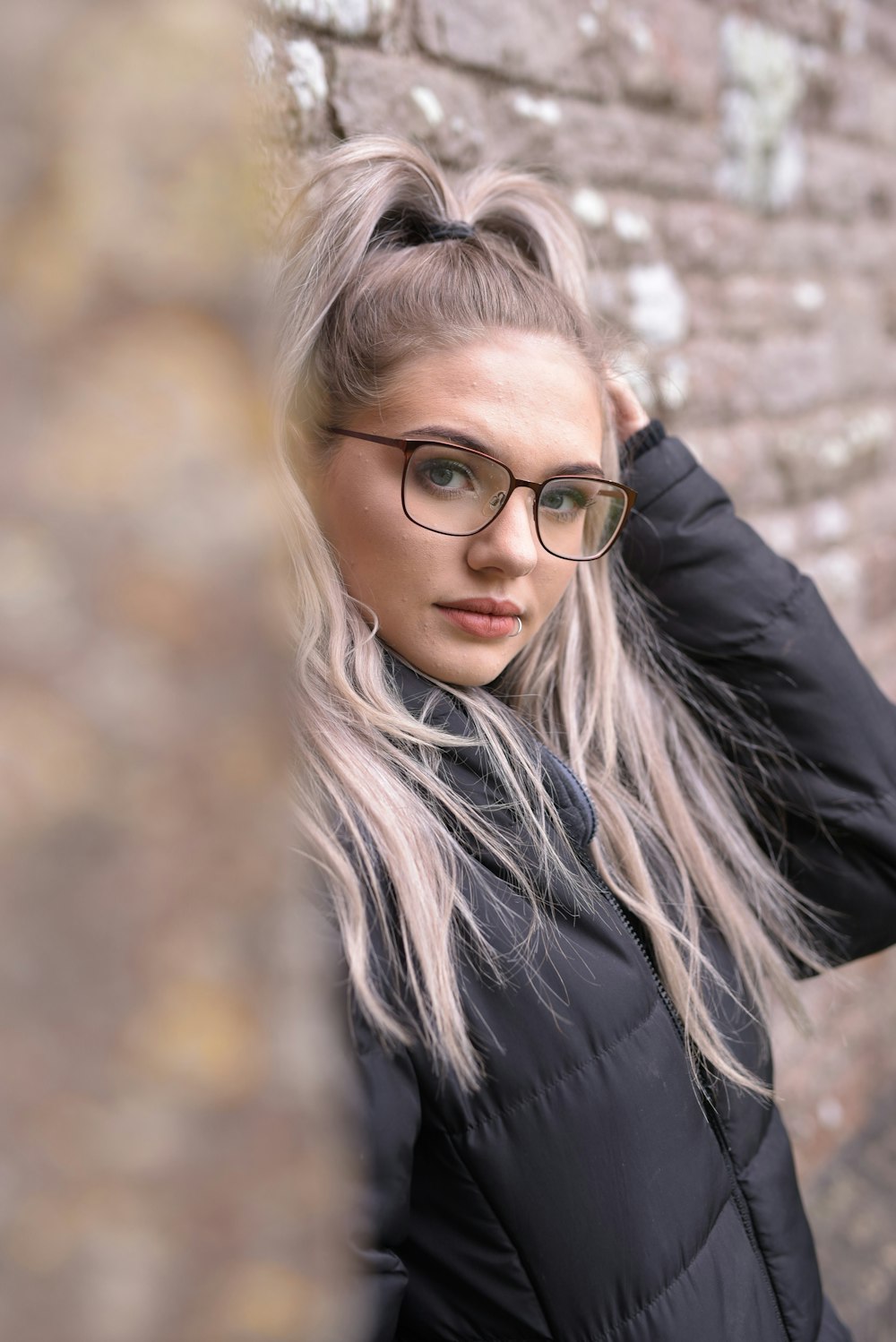 woman in black jacket wearing eyeglasses