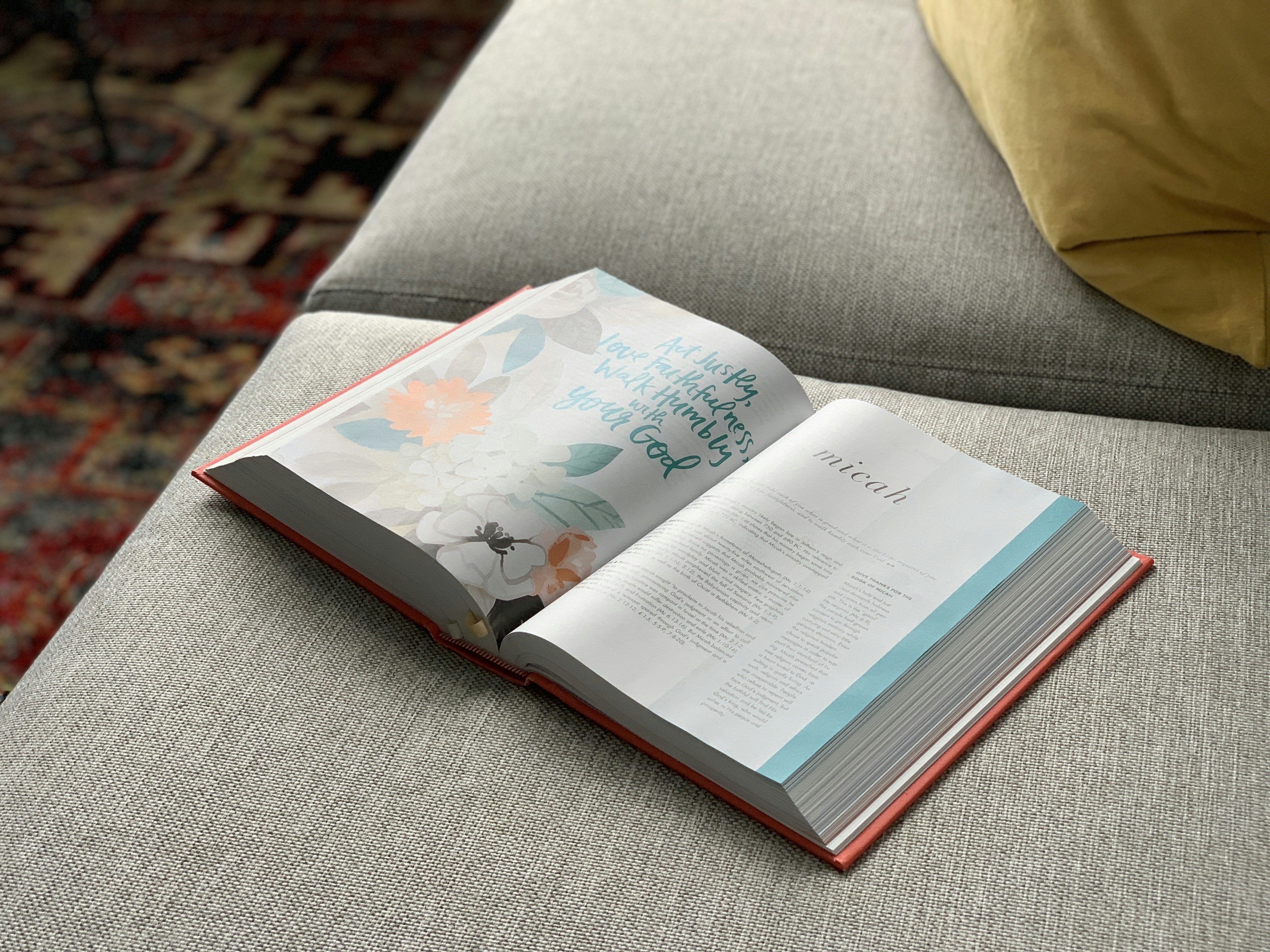 white book on gray textile